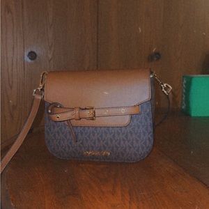 Selling a Michael Kors purse, brown with black. Perfect size, used once